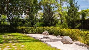 The Zen garden uses elements of raked sand and rocks to form dry gardens, intended to embody serenity and inspire reflection.